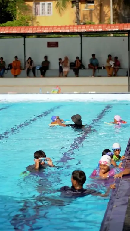 Hand over hand along the pool edge—venturing into the deep end with courage!…
